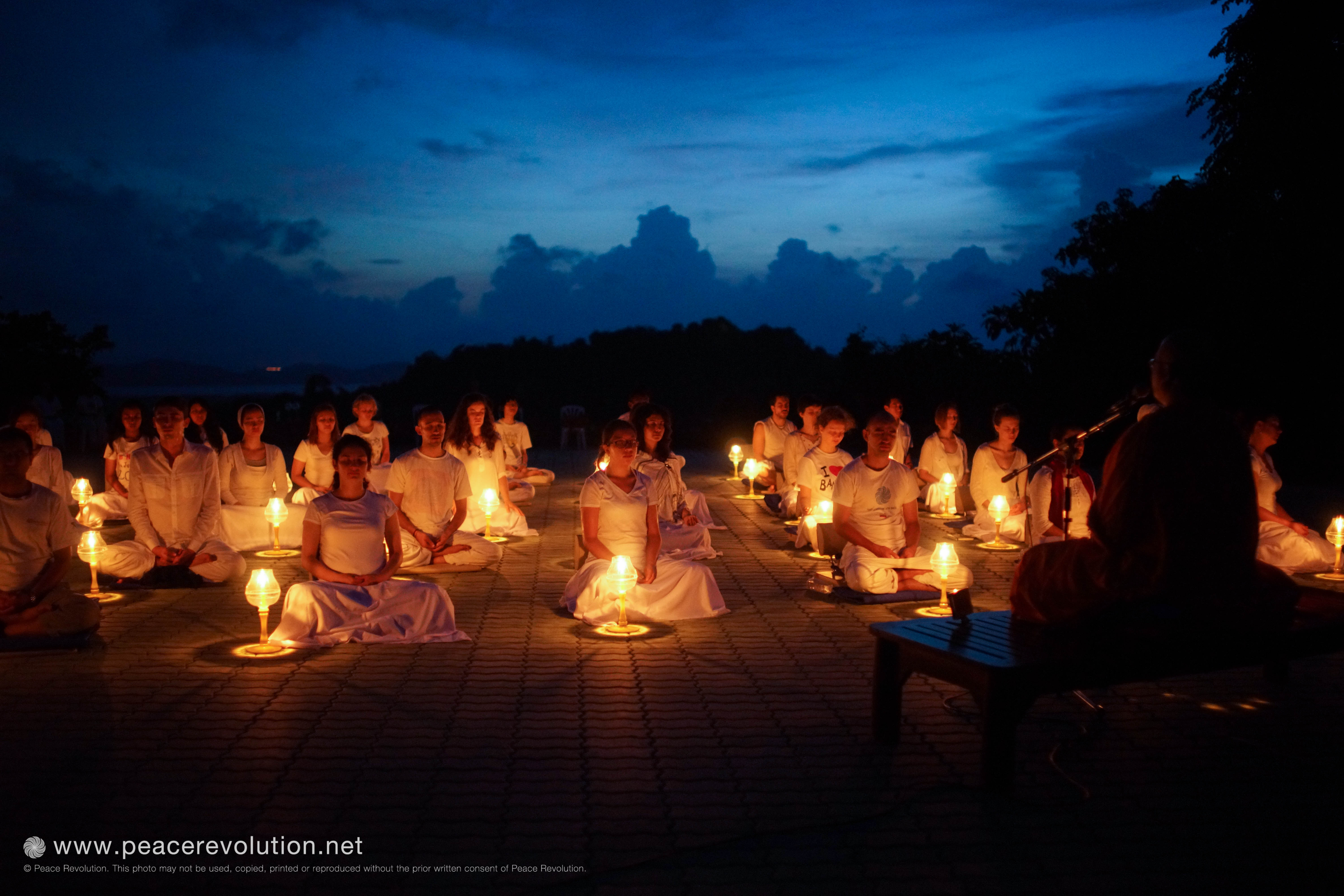 Meditation under the glow of candlelight