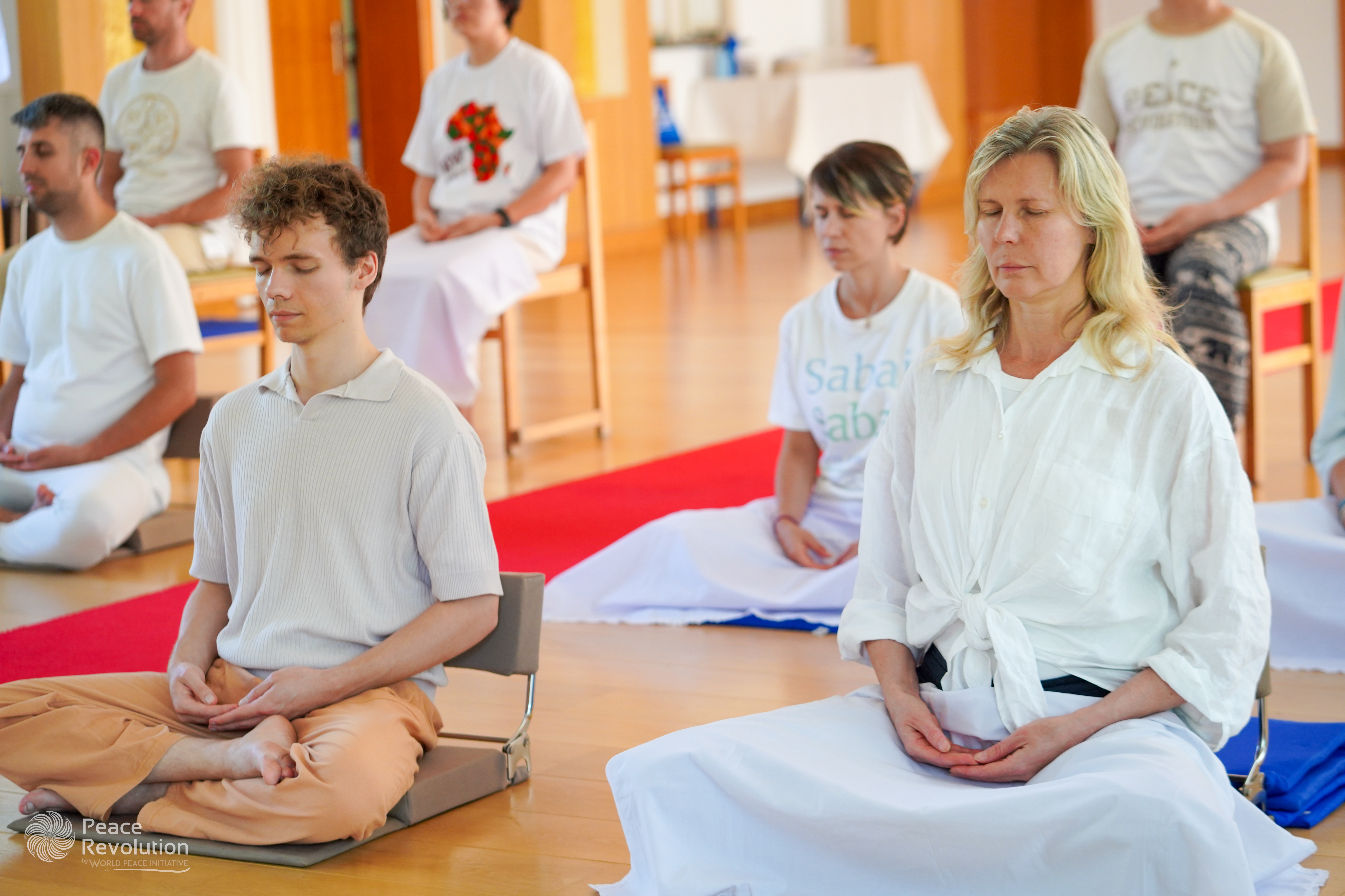 Meditation practitioners in hall